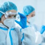 asian docs putting on ppe