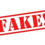 fake rubber stamp red over white background 86701546