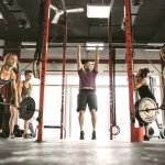 Group Fitness Class Performing A Variety Of Exercises 1