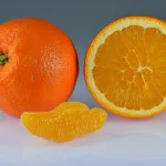 Oranges whole halved segment.jpg