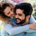 young woman hugging partner from behind 768