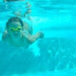 adorable little girl in the swimming pool underwater video