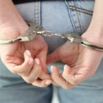 arrested woman with handcuffs 1 1