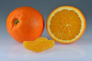 Oranges whole halved segment.jpg